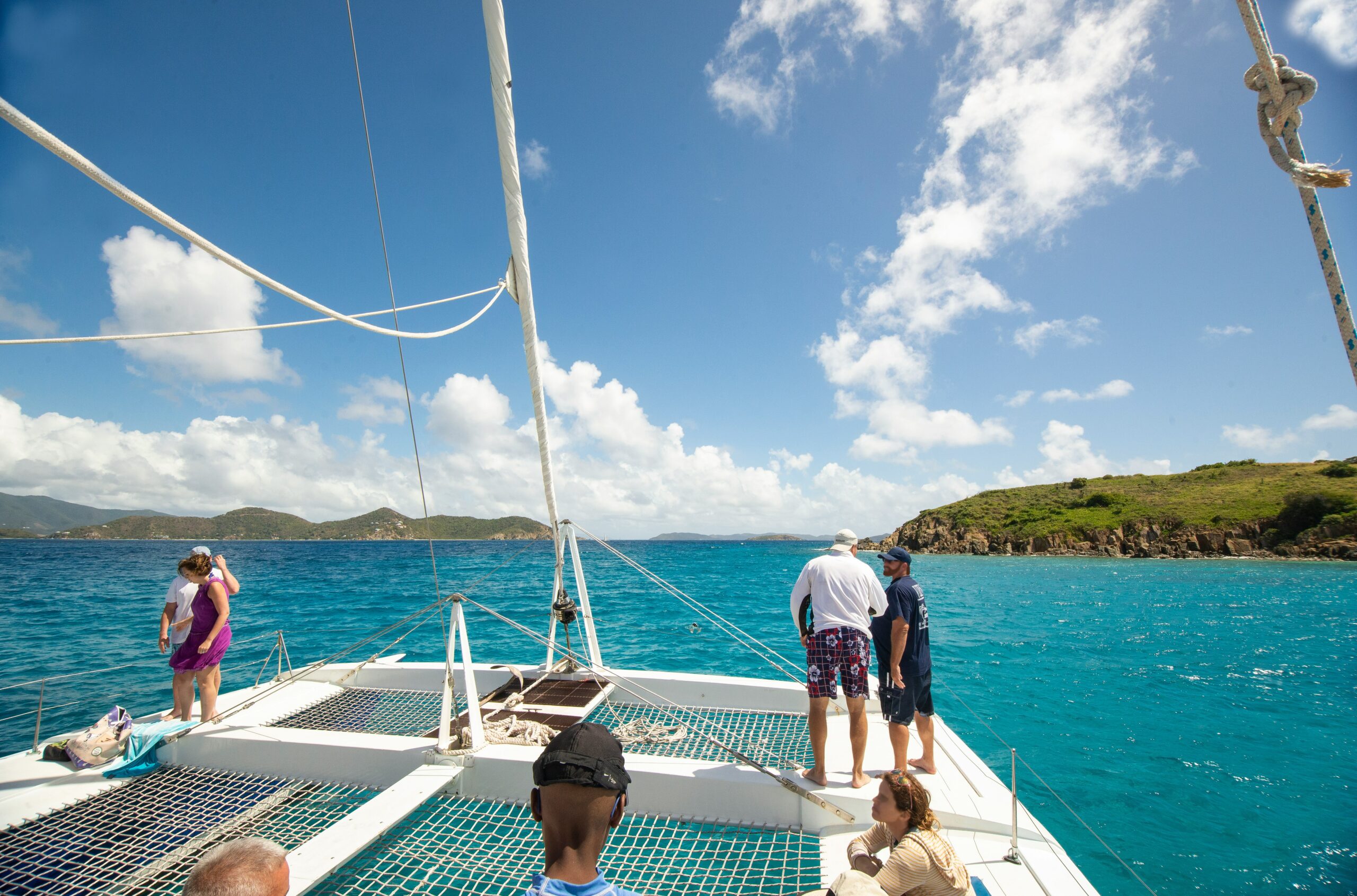 a group of people on a boat in the ocean