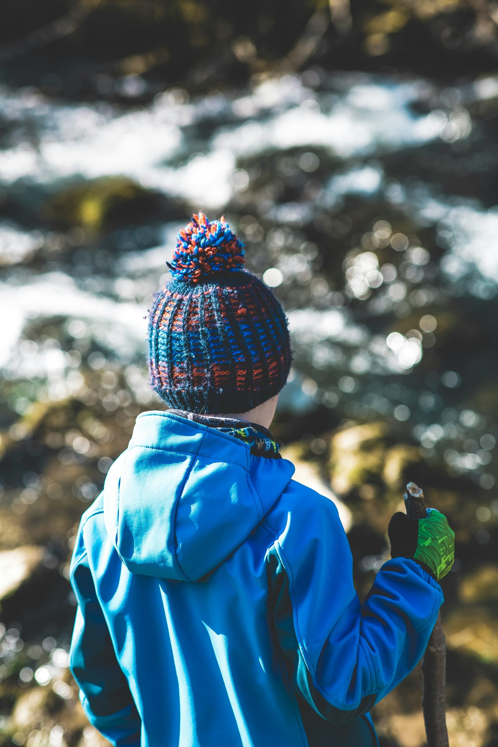 person in blue jacket wearing knit cap